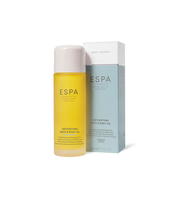 ESPA Detoxifying Bath & Body Oil in a yellow bottle 